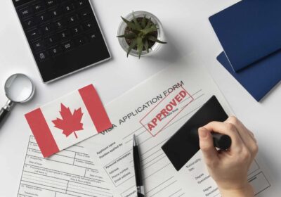 visa-application-composition-with-canadian-flag-scaled-1